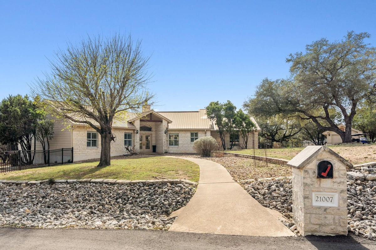View 21007 Newhaven CV in Highland Lake Estates Sec 32 21007 Newhaven CV - property photo 1 - Luxury home in Highland Lake Estates Sec 32, Lago Vista, TX