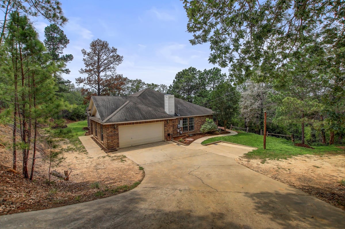 View 211 Ulupau Cir in Tahitian Village 211 Ulupau Cir - front exterior - Luxury home in Tahitian Village, Bastrop, TX