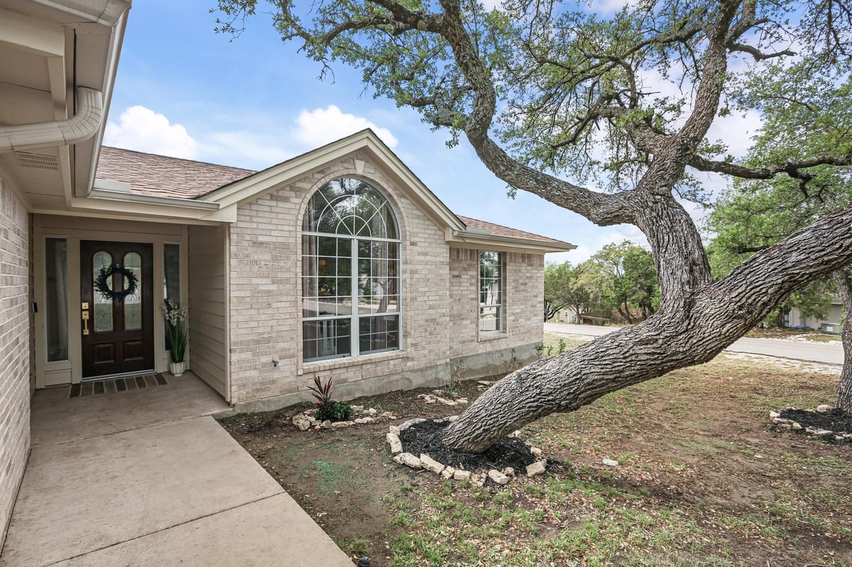 View 21105 Newport Cv in Highland Lake Estates Sec 32 21105 Newport Cv - front exterior - Luxury home in Highland Lake Estates Sec 32, Lago Vista, TX