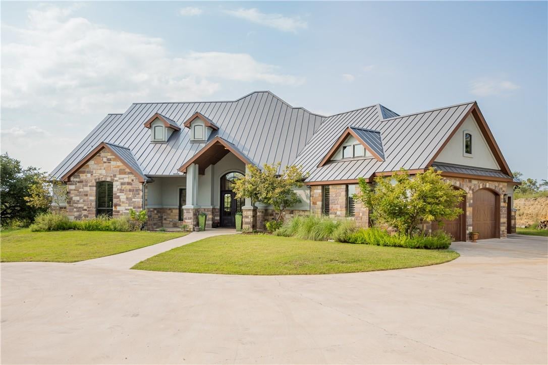 View 21301 Dill Cir in Bee Creek Ranchettes Sec 01 21301 Dill Cir - front exterior - Luxury home in Bee Creek Ranchettes Sec 01, Spicewood, TX