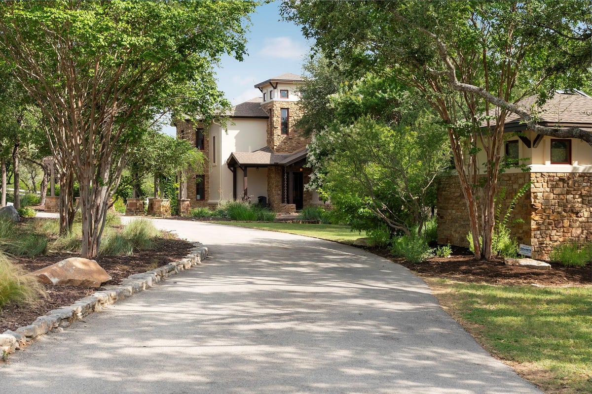 View 21311 Hamilton Pool Rd in Ranches At Hamilton Pool The 21311 Hamilton Pool Rd - front exterior - Luxury home in Ranches At Hamilton Pool The, Dripping Springs, TX