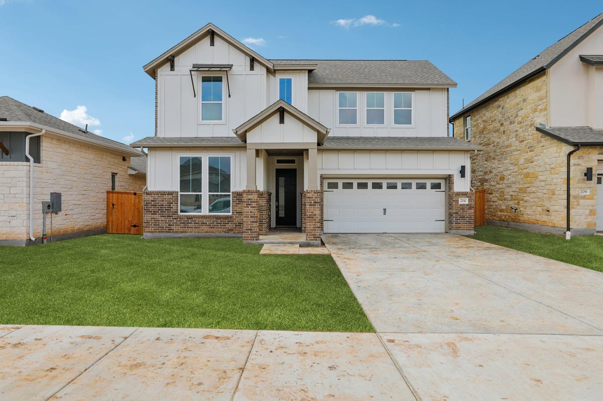 View 214 San Saba Dr in Persimmon 214 San Saba Dr - front exterior - Luxury home in Persimmon, Buda, TX