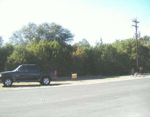 View 21501 Paseo De Vaca 21501 Paseo De Vaca - front exterior - Luxury lot in Lago Vista, TX