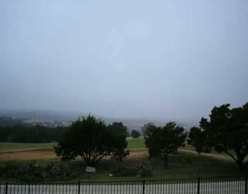 View 217 Jack Nicklaus DR 217 Jack Nicklaus DR - front exterior - Luxury lot in Lakeway, TX
