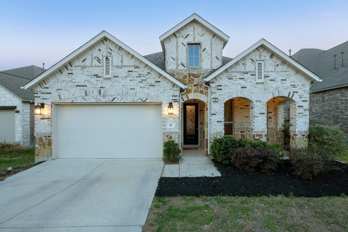 View 217 Mineral River Loop in 6 Creeks at Waterridge: 55ft. lots 217 Mineral River Loop - front exterior - Luxury home in 6 Creeks at Waterridge: 55ft. lots, Kyle, TX