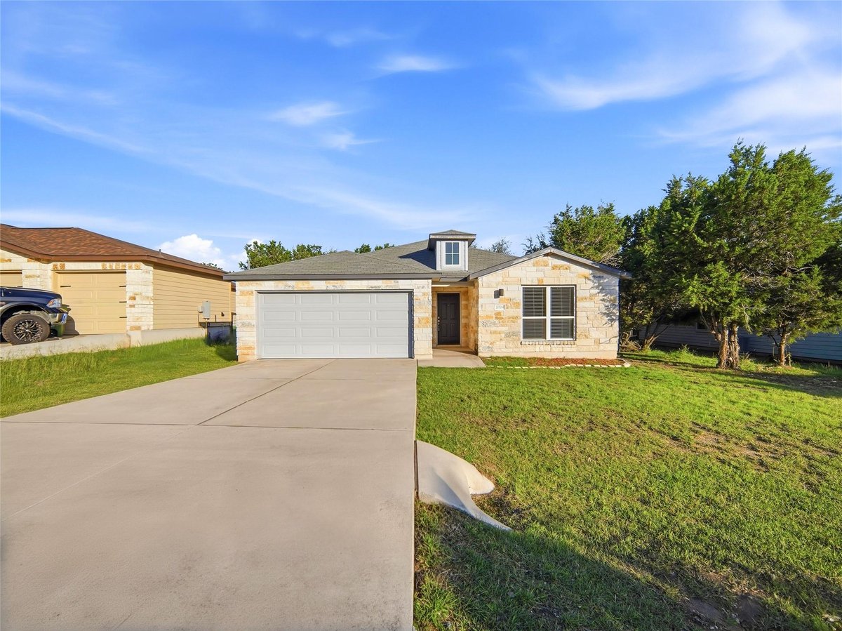 View 21709 Crystal Way in Highland Lake Estates Sec 34 21709 Crystal Way - front exterior - Luxury home in Highland Lake Estates Sec 34, Lago Vista, TX