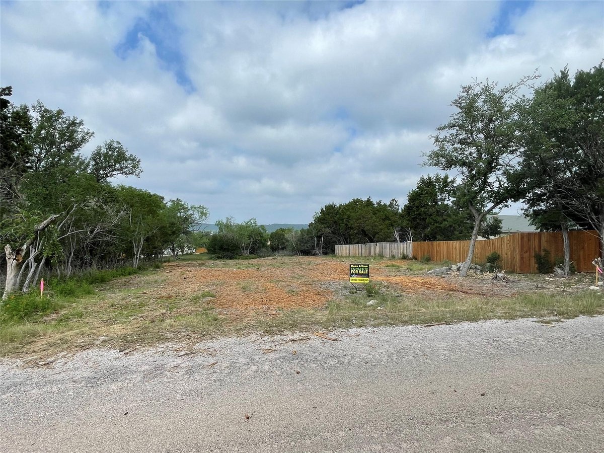 View 21709 Oregon Ln in Highland Lake Estates Sec 34 21709 Oregon Ln - property photo 1 - Luxury lot in Highland Lake Estates Sec 34, Lago Vista, TX