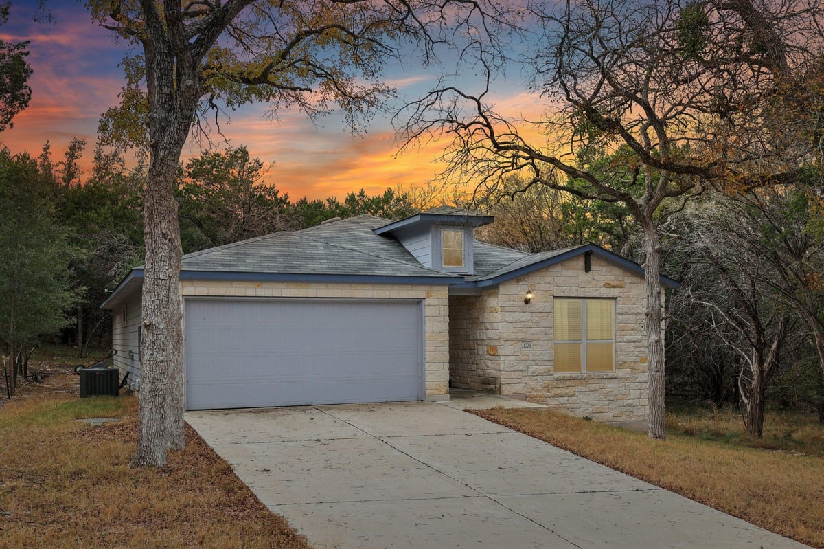 View 21709 Osage Ln in Highland Lake Estates Sec 33 21709 Osage Ln - front exterior - Luxury home in Highland Lake Estates Sec 33, Lago Vista, TX
