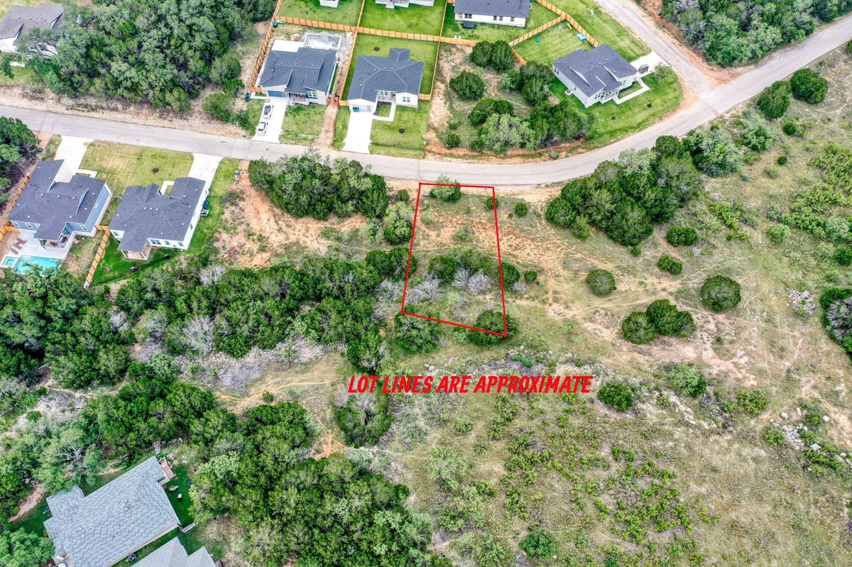 View 21800 Pope DR in Highland Lake Estates Sec 29 21800 Pope DR - front exterior - Luxury lot in Highland Lake Estates Sec 29, Lago Vista, TX