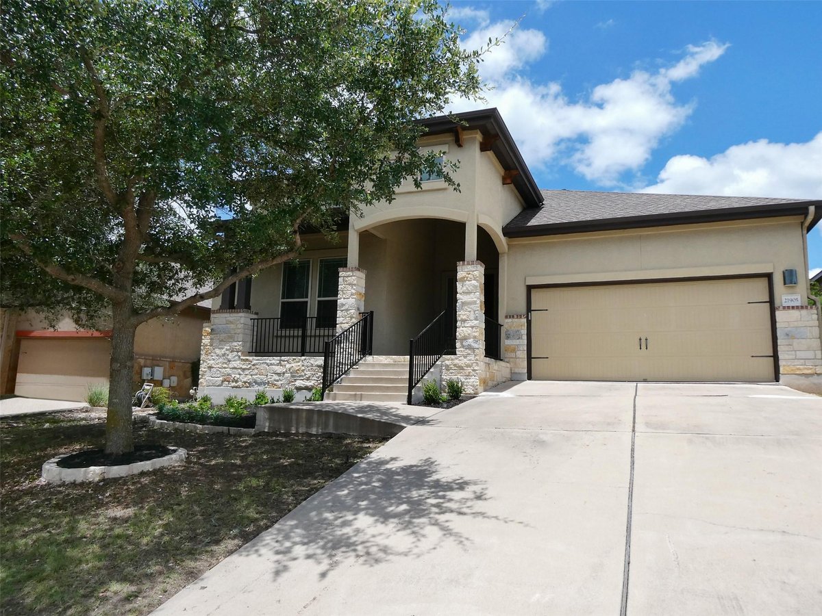 View 21905 Rock Wren Rd in West Cypress Hills Ph 1 Sec 4 21905 Rock Wren Rd - front exterior - Luxury home in West Cypress Hills Ph 1 Sec 4, Spicewood, TX