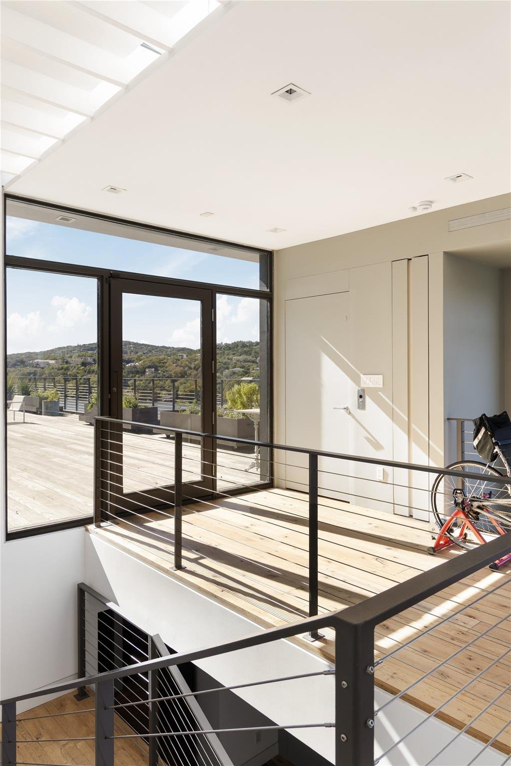 Patio with expansive glass sliding doors with dark  at 2200 Scenic Dr - 3 bed 4 bath home