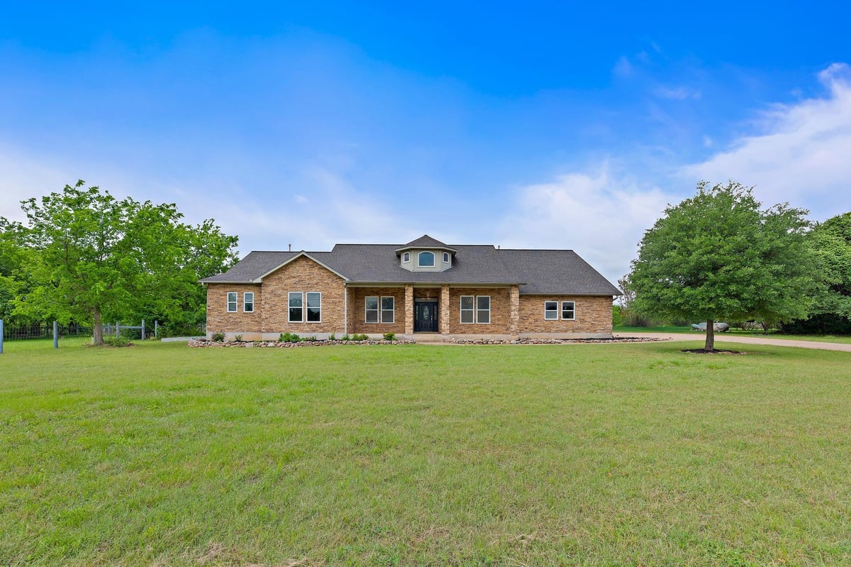 View 221 Mustang Mesa in Sundance Ranch North 221 Mustang Mesa - front exterior - Luxury home in Sundance Ranch North, Liberty Hill, TX