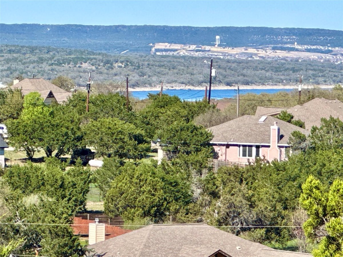 View 22122 Moulin Dr in Briarcliff Inc Sec 12 22122 Moulin Dr - front exterior - Luxury lot in Briarcliff Inc Sec 12, Spicewood, TX