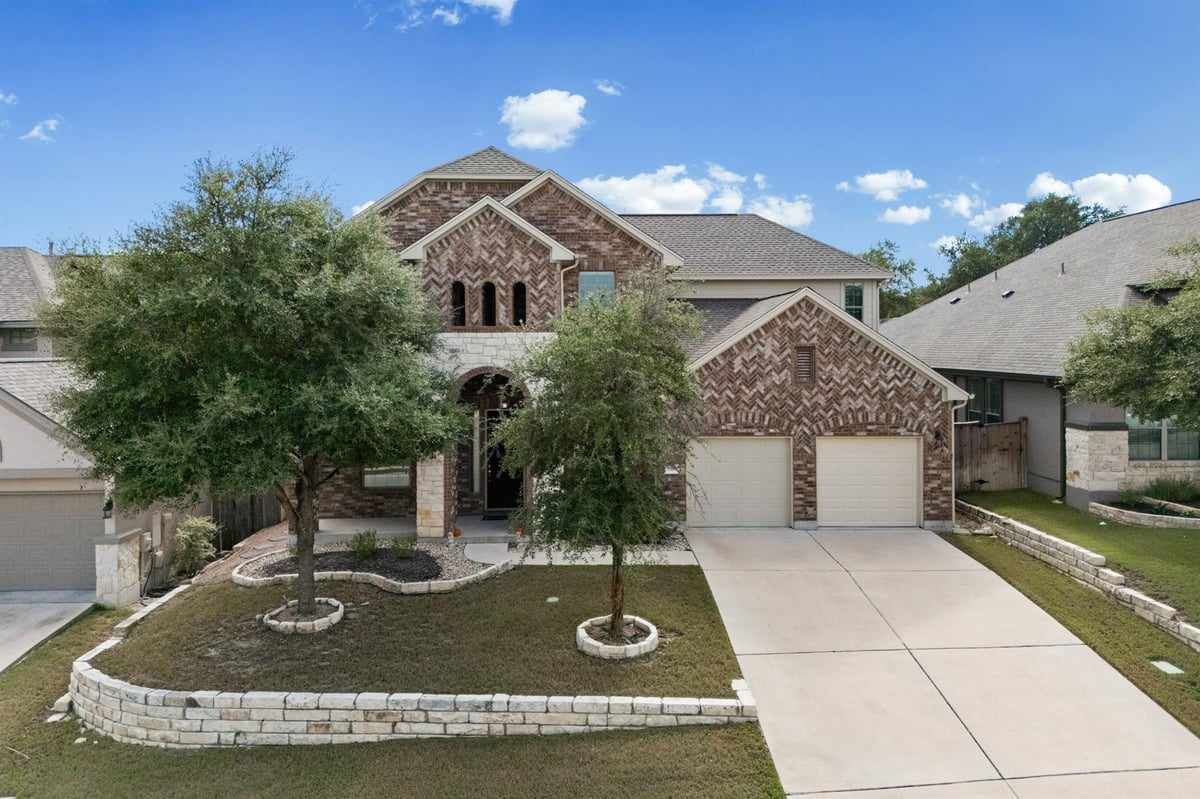 View 2216 Lookout Knoll Dr in Bluffs At Crystal Falls Sec 2 2216 Lookout Knoll Dr - front exterior - Luxury home in Bluffs At Crystal Falls Sec 2, Leander, TX