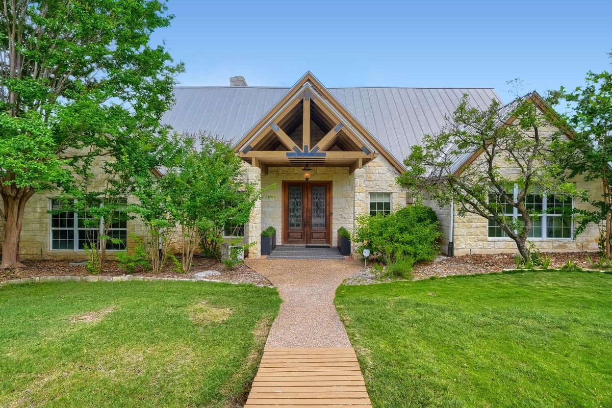 View 222 Winn Valley DR in Misty Meadows 222 Winn Valley DR - front exterior - Luxury home in Misty Meadows, Wimberley, TX