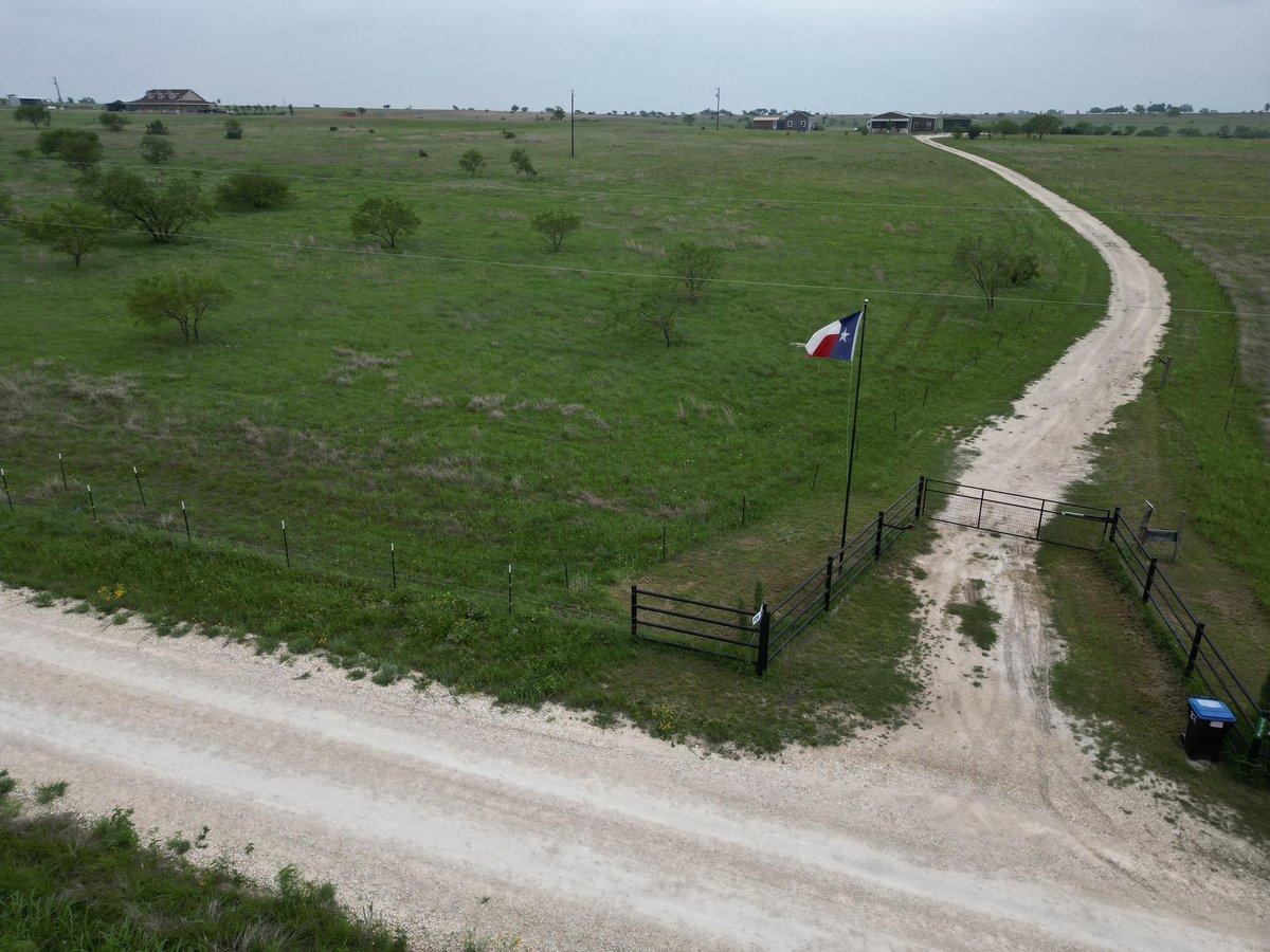 View 2238 County Road 2109 in Austin Co Three League 2238 County Road 2109 - front exterior - Luxury home in Austin Co Three League, Lometa, TX