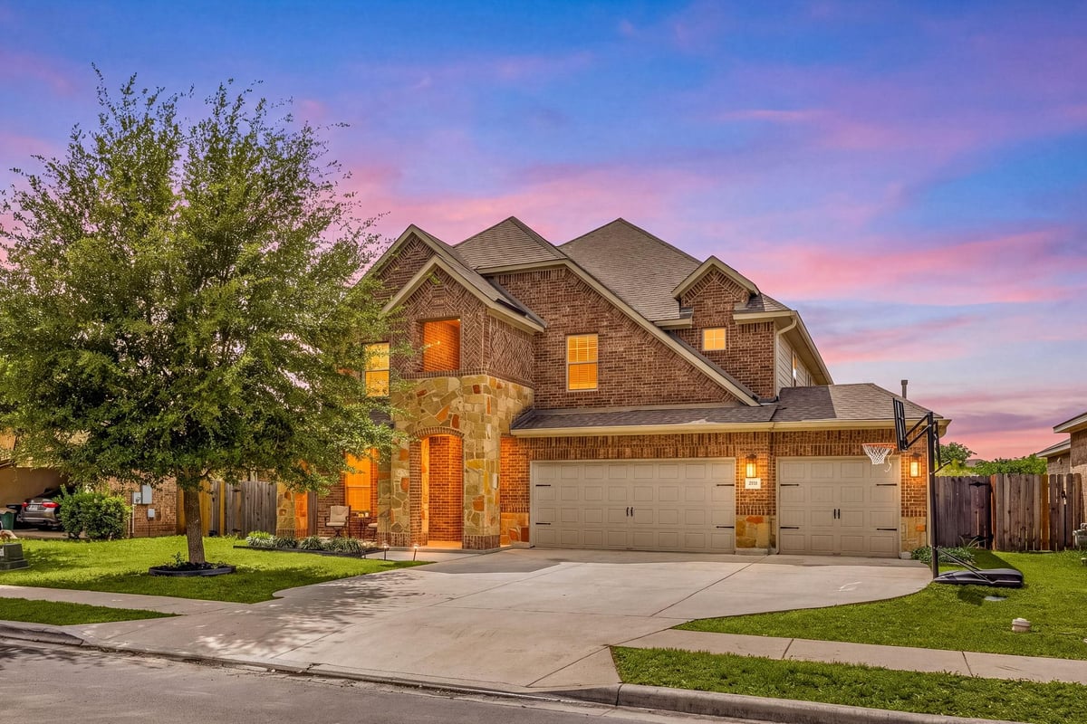 View 225 Pettigrew Path in Garlic Creek West Ph Iii Sec 6A 225 Pettigrew Path - front exterior - Luxury home in Garlic Creek West Ph Iii Sec 6A, Buda, TX