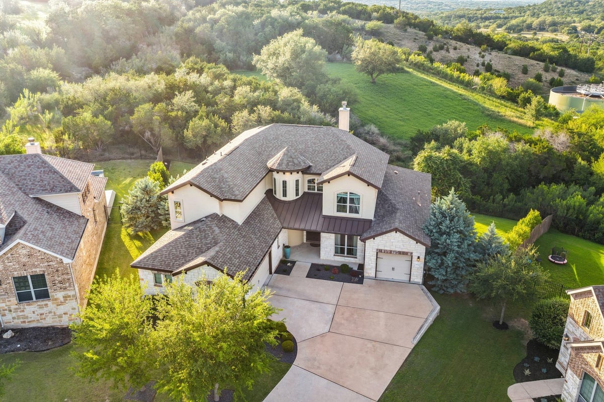 View 22524 Rock Wren Rd in West Cypress Hills Ph 1 Sec 3 22524 Rock Wren Rd - front exterior - Luxury home in West Cypress Hills Ph 1 Sec 3, Spicewood, TX