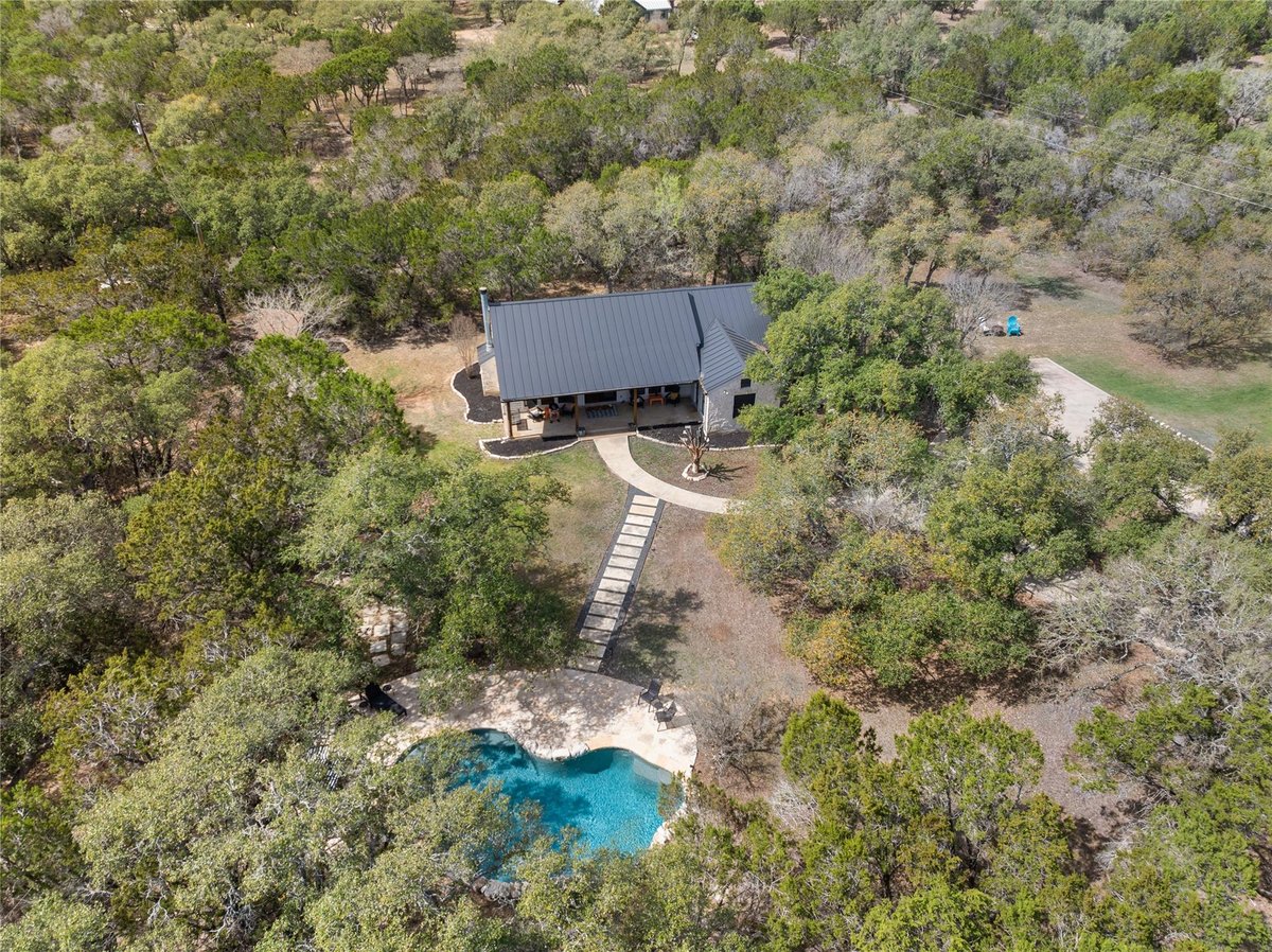 View 2300 River RD in River Meadows Ph 5 2300 River RD - front exterior - Luxury home in River Meadows Ph 5, Wimberley, TX