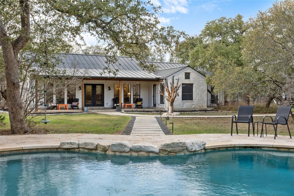 View 2300 River Rd in River Meadows Ph 5 2300 River Rd - front exterior - Luxury home in River Meadows Ph 5, Wimberley, TX