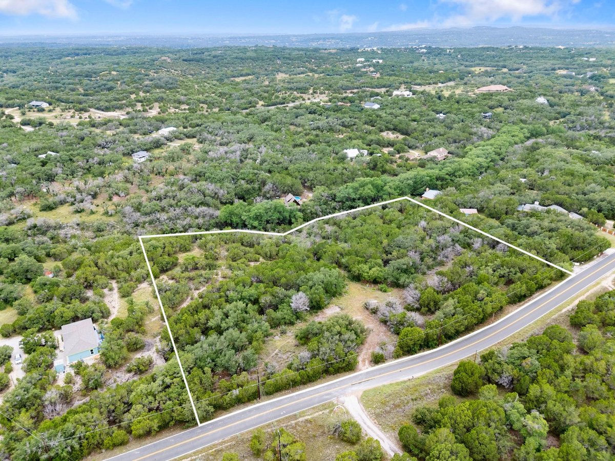 View 23070 Pedernales Canyon TRL in Lick Creek Ranch 23070 Pedernales Canyon TRL - front exterior - Luxury lot in Lick Creek Ranch, Spicewood, TX