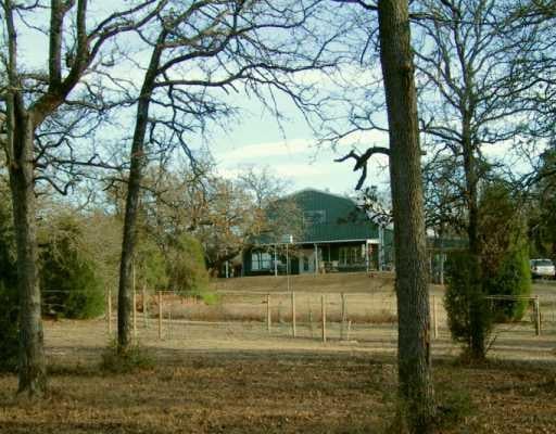 View 2335 FM 696 2335 FM 696 - front exterior - Luxury home in Lexington, TX