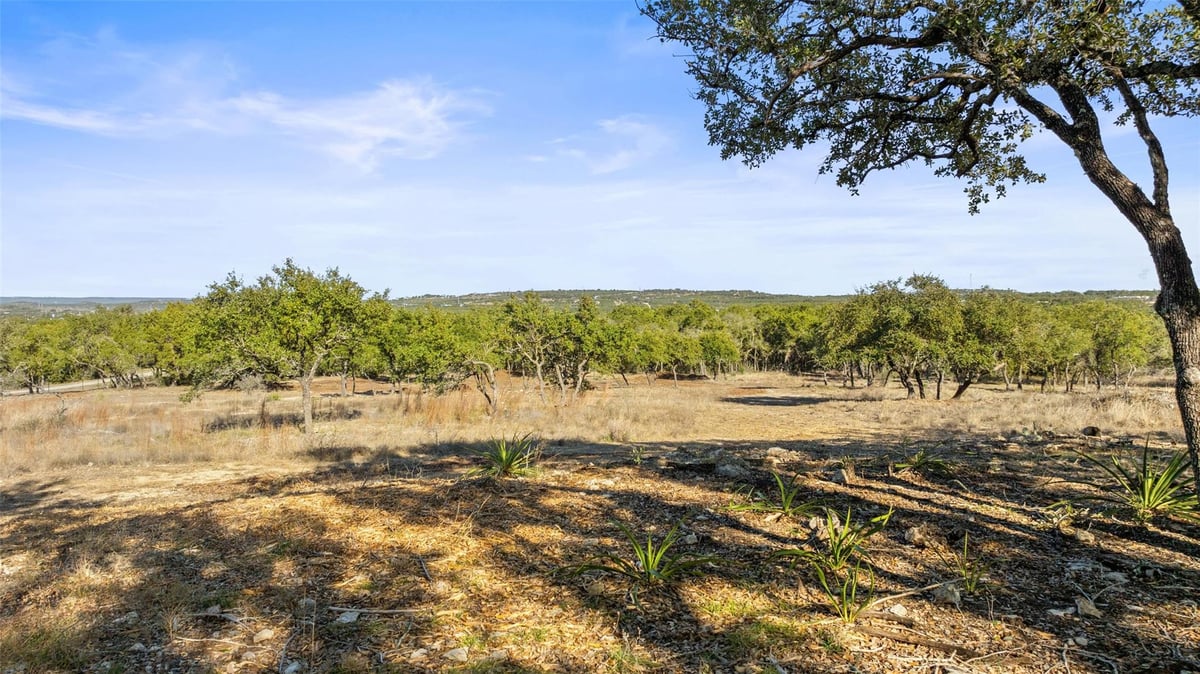 Primary bedroom at 23405 Pedernales Canyon Trl - ABS 13 SUR 1 GRITTEN, Spicewood, TX