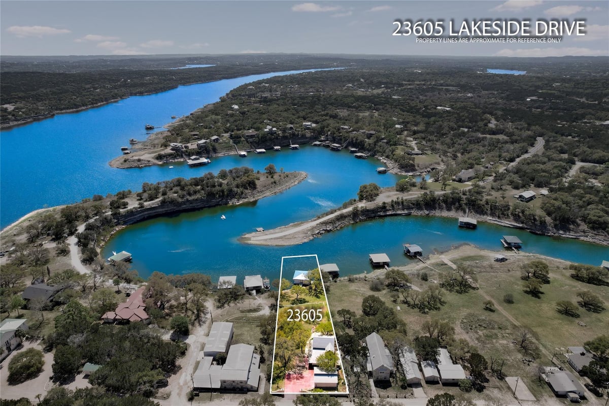 View 23605 Lakeside DR in Flat Creek Resub 23605 Lakeside DR - front exterior - Luxury home in Flat Creek Resub, Marble Falls, TX