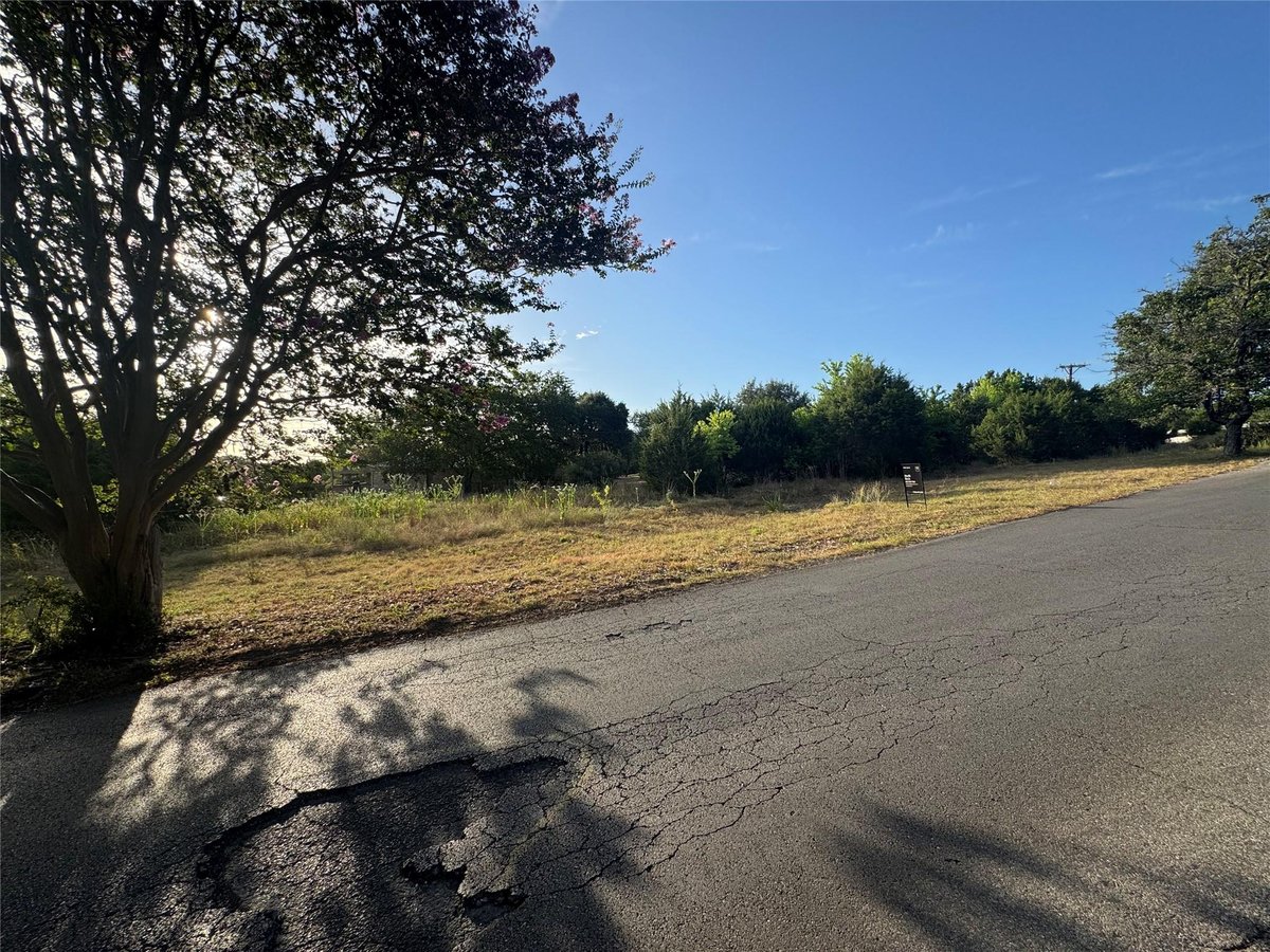 View 237 Woodcreek Dr in Woodcreek Sec 1 237 Woodcreek Dr - property photo 1 - Luxury lot in Woodcreek Sec 1, Wimberley, TX