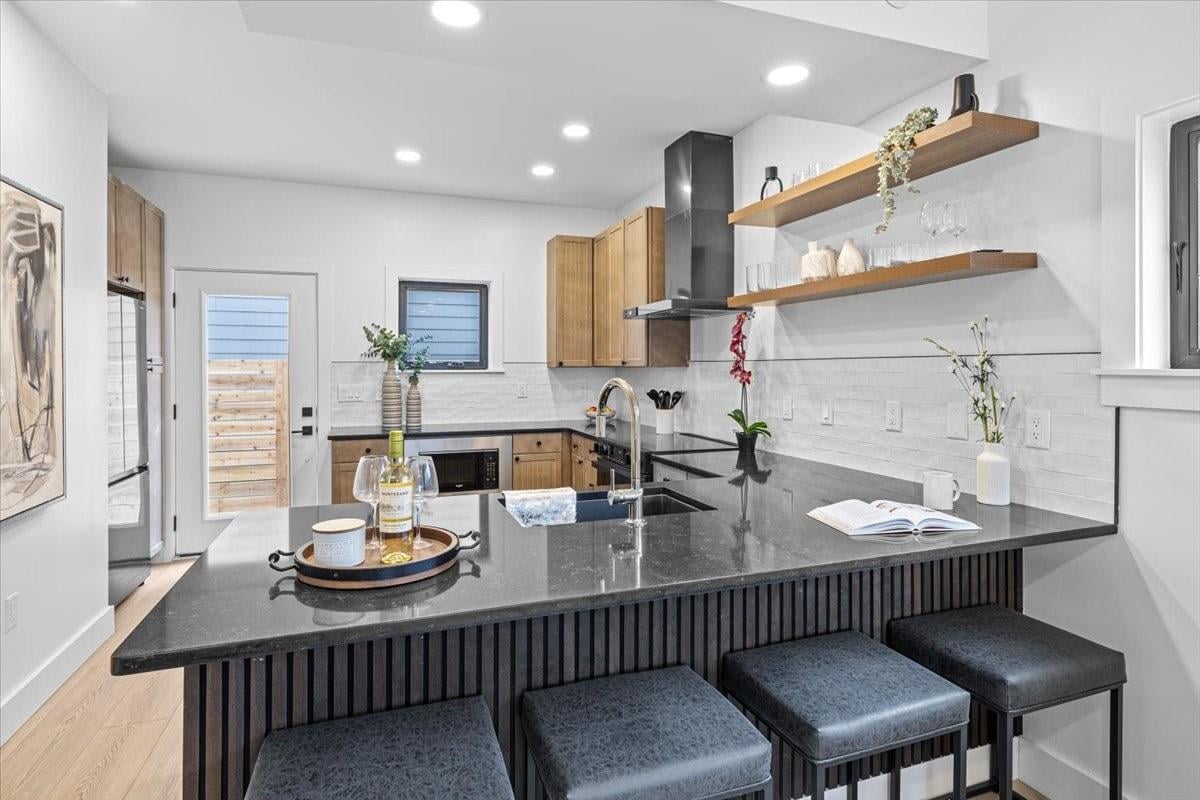 Kitchen at 2406 W 10th St Unit #A - 3 bed 2 bath home