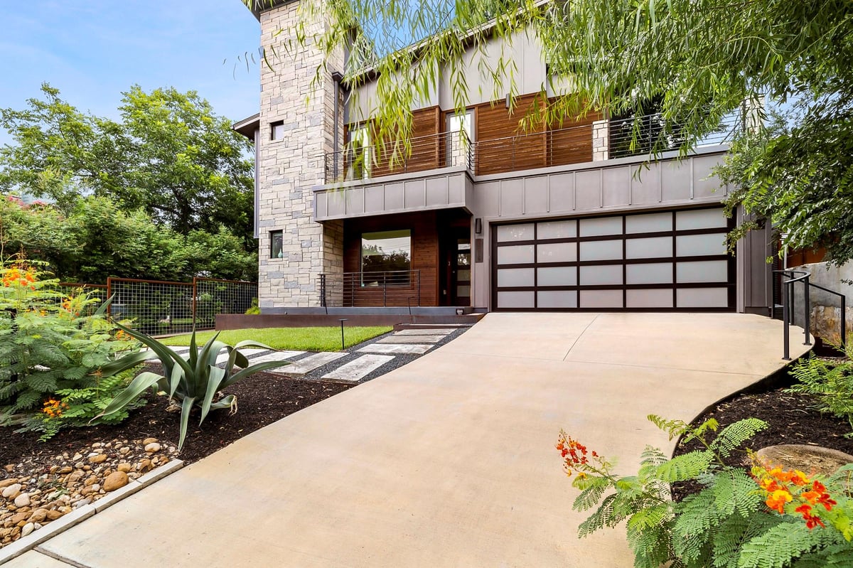 View 2414 Kinney Rd in Ashten Add 2414 Kinney Rd - front exterior with modern urban facade and garage courtyard - Luxury home in Ashten Add, Austin, TX