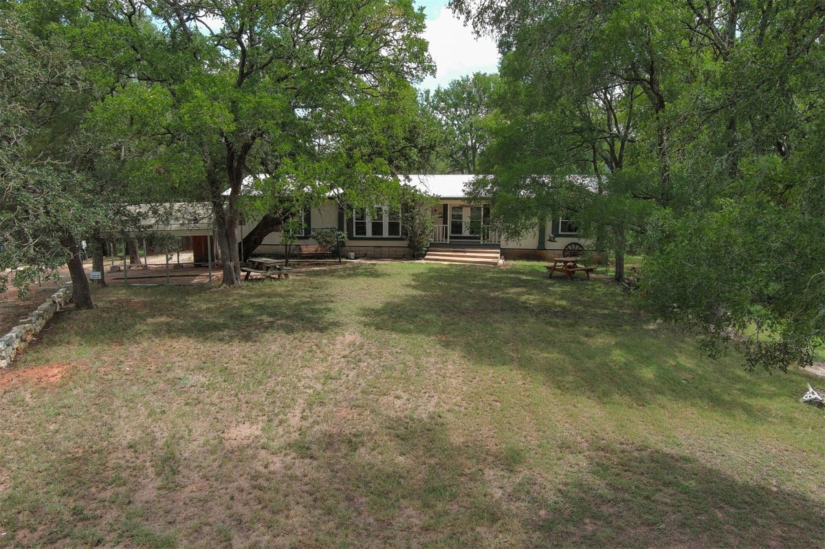 View 243 Piney Ridge Dr in Piney Ridge 243 Piney Ridge Dr - front exterior - Luxury home in Piney Ridge, Bastrop, TX