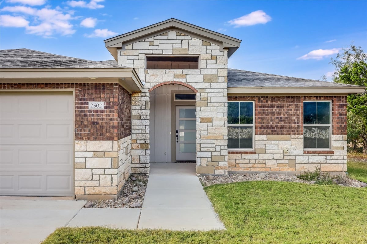 View 2502 Truman Dr in Highland Lake Estates Sec 29 2502 Truman Dr - front exterior - Luxury home in Highland Lake Estates Sec 29, Lago Vista, TX
