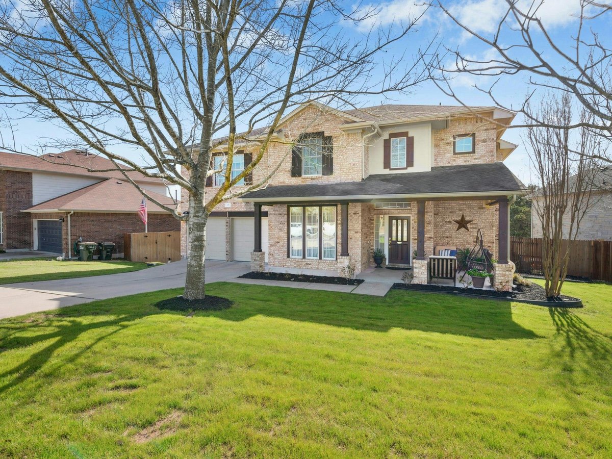 View 251 Lexington Dr in Belterra Ph Ii Sec 3B 251 Lexington Dr - front exterior - Luxury home in Belterra Ph Ii Sec 3B, Austin, TX
