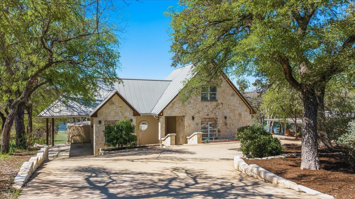 View 25207 Lake View Dr in Pedernales 25207 Lake View Dr - front exterior - Luxury home in Pedernales, Spicewood, TX