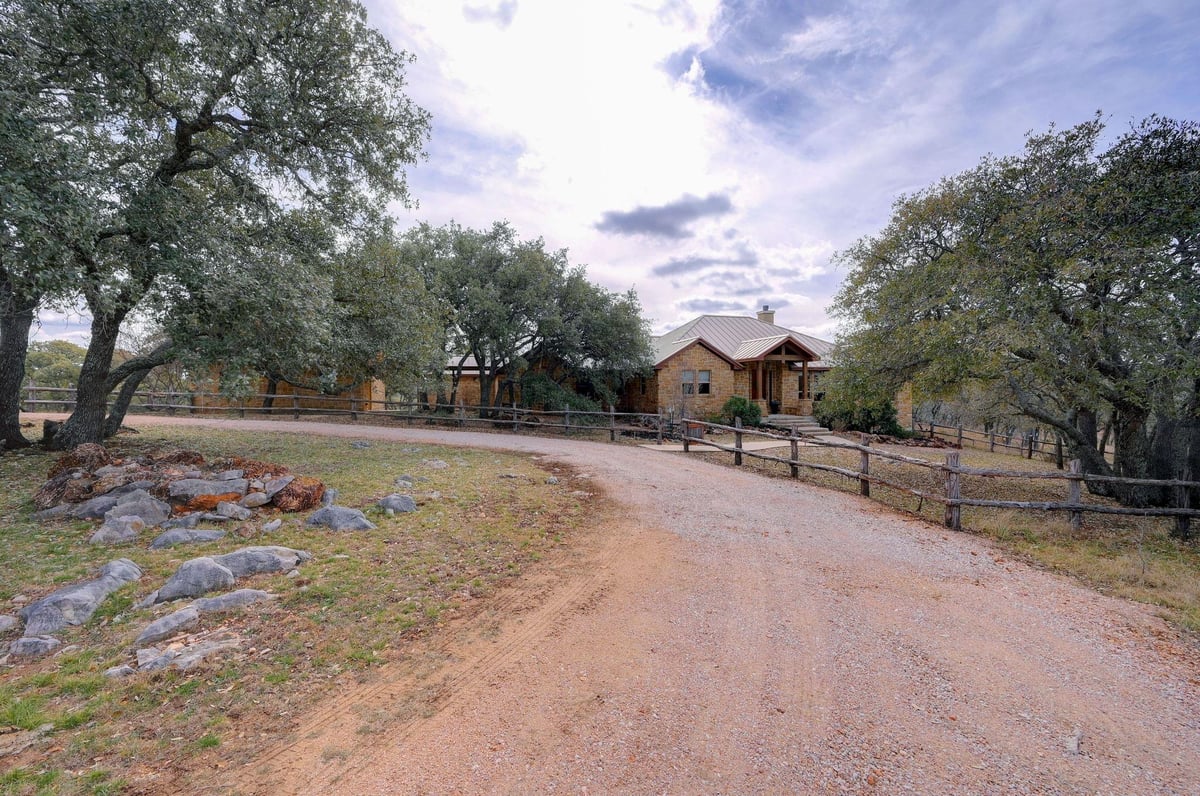 View 2551 Wolf Creek Ranch Rd in Wolf Creek Ranch 2551 Wolf Creek Ranch Rd - front exterior - Luxury home in Wolf Creek Ranch, Burnet, TX