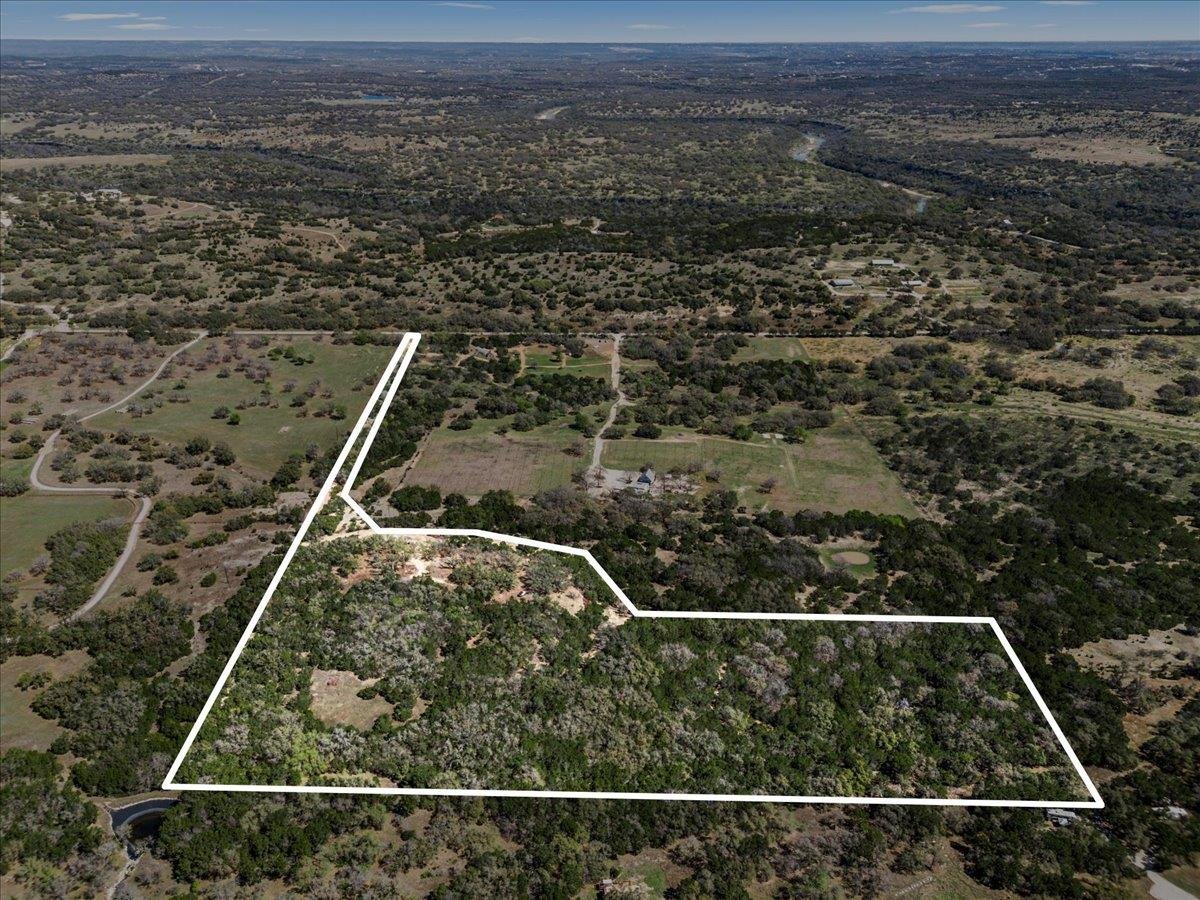 Primary bedroom at 25723 Hamilton Pool Rd - None, Round Mountain, TX