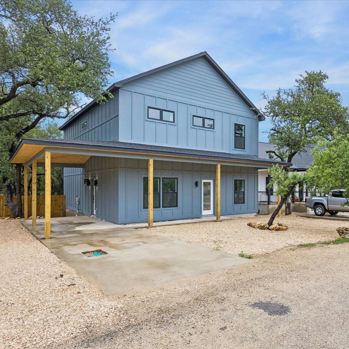 View 26 Wood Glen DR in Woodcreek Sec 22 26 Wood Glen DR - front exterior - Luxury home in Woodcreek Sec 22, Wimberley, TX