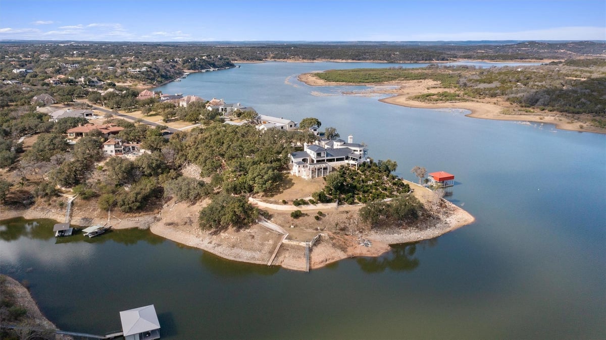 Aerial view with lakefront peninsula property at 26100 Countryside Dr - 5 bed 5 bath home