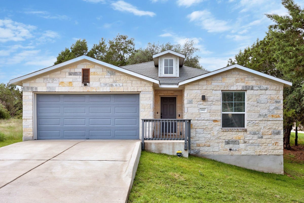 View 2612 American Dr in Highland Lake Estates Sec 29 2612 American Dr - front exterior - Luxury home in Highland Lake Estates Sec 29, Lago Vista, TX