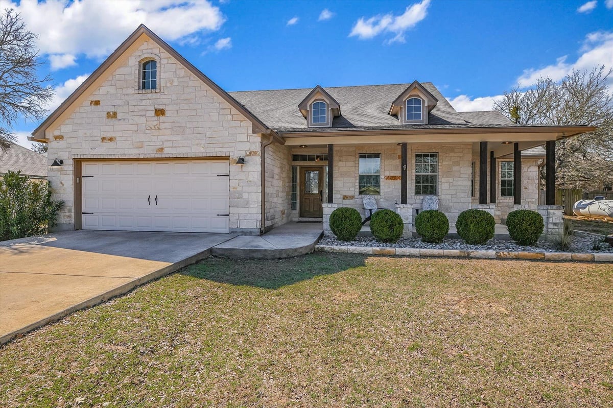 View 27 Whispering Valley Dr in Woodcreek Sec 9-B 27 Whispering Valley Dr - front exterior - Luxury home in Woodcreek Sec 9-B, Wimberley, TX