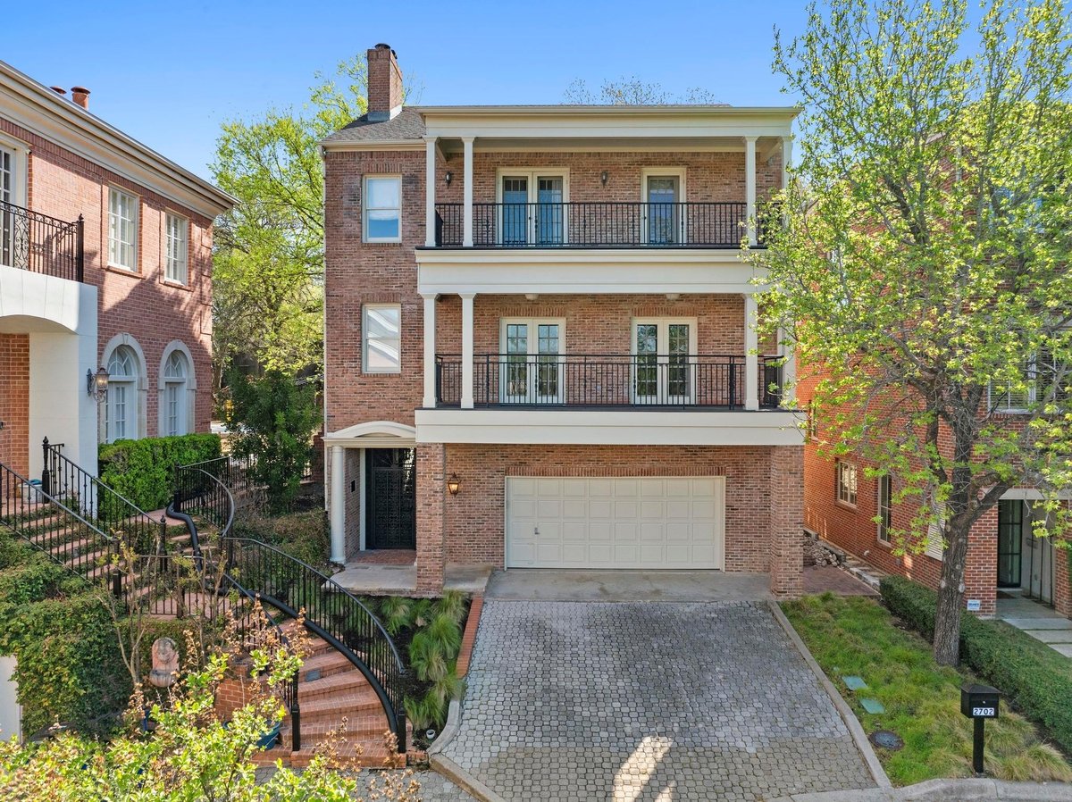 View 2702 Hillview Green Ln in Hillview Green 2702 Hillview Green Ln - front exterior with townhome-style facade and brick exterior - Luxury home in Hillview Green, Aus...