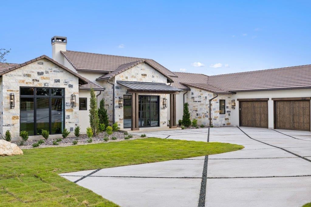 View 27031 Haynie Flat Rd in Ranch At Lakeside Sec 01 27031 Haynie Flat Rd - front exterior - Luxury home in Ranch At Lakeside Sec 01, Spicewood, TX