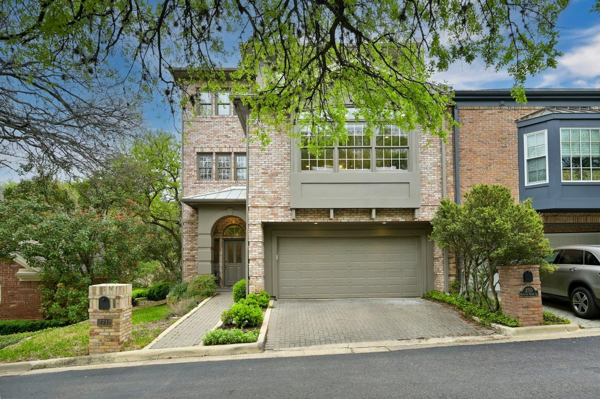 View 2712 Hillview Green Ln in Hillview Green 2712 Hillview Green Ln - front exterior with townhome-style brick facade - Luxury home in Hillview Green, Austin, TX