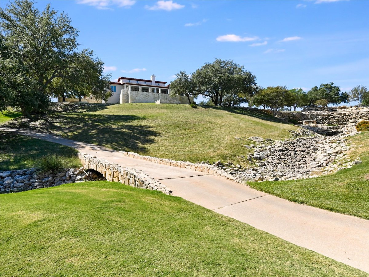 27206 Waterfall Hill Pkwy - front exterior - Luxury home in Barton Creek Lakeside, Ranch, Spicewood, TX