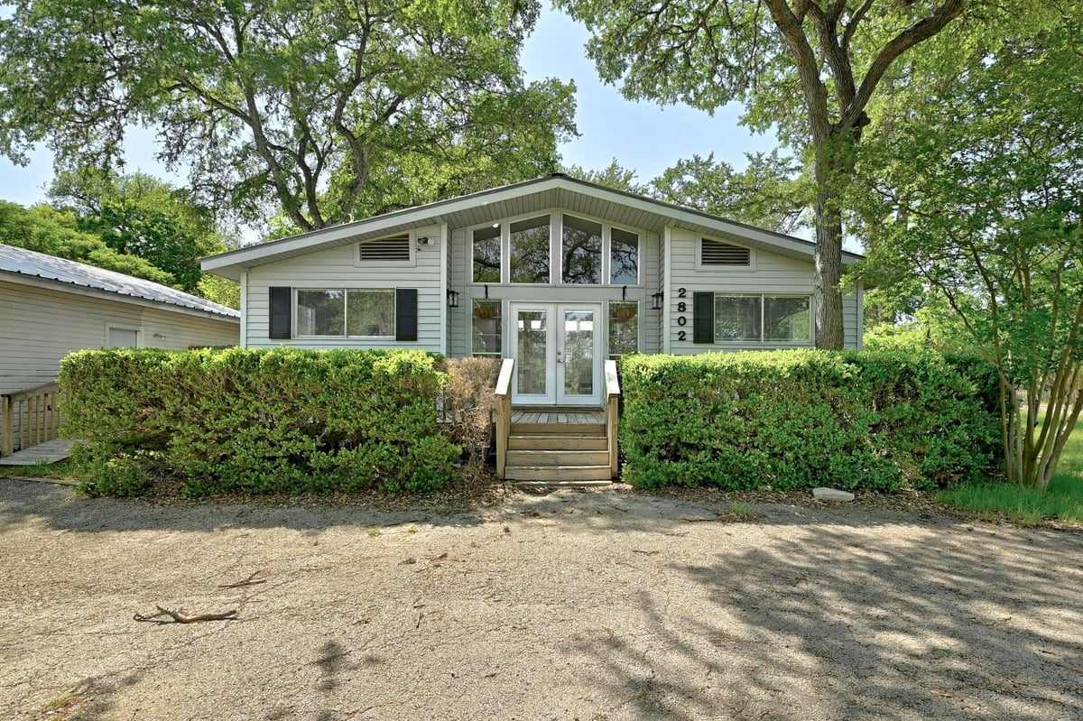 View 2802 San Juan DR in Austin Lake Estates Sec 01 2802 San Juan DR - front exterior - Luxury home in Austin Lake Estates Sec 01, Austin, TX