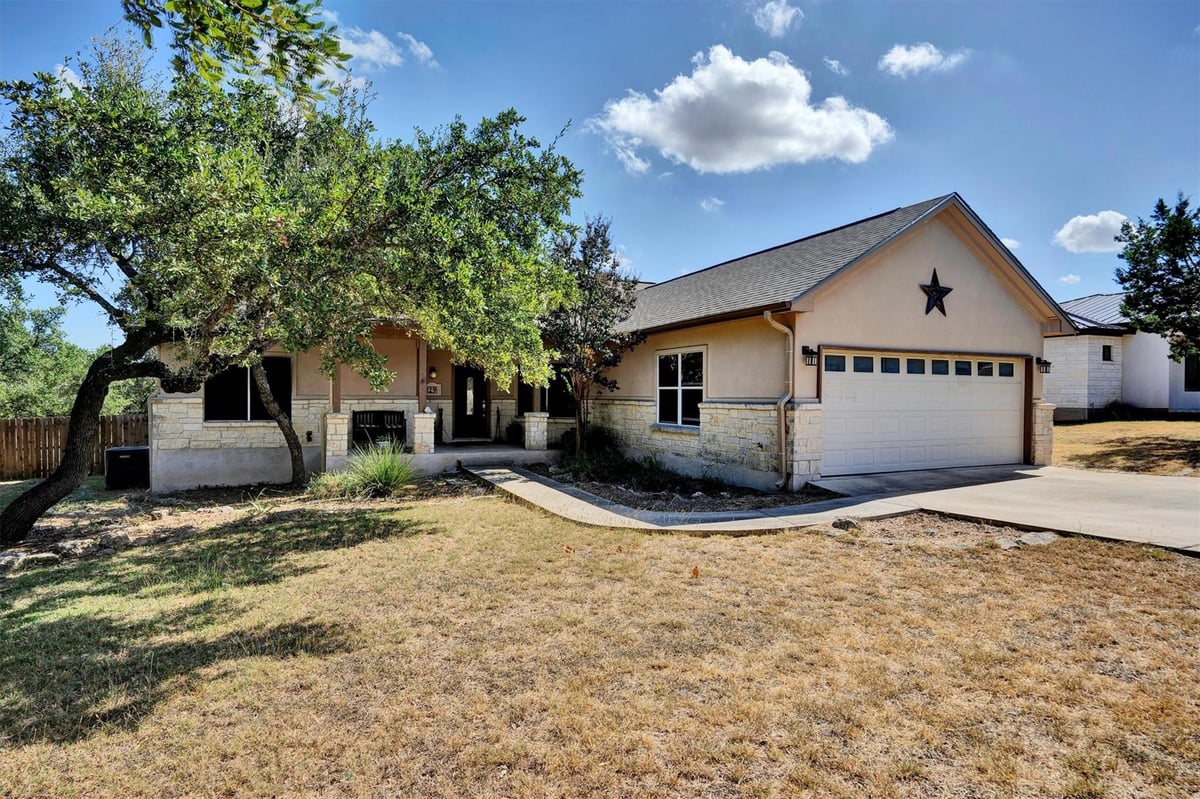 View 29 Champions Cir in Woodcreek Sec 2 29 Champions Cir - property photo 1 - Luxury home in Woodcreek Sec 2, Wimberley, TX