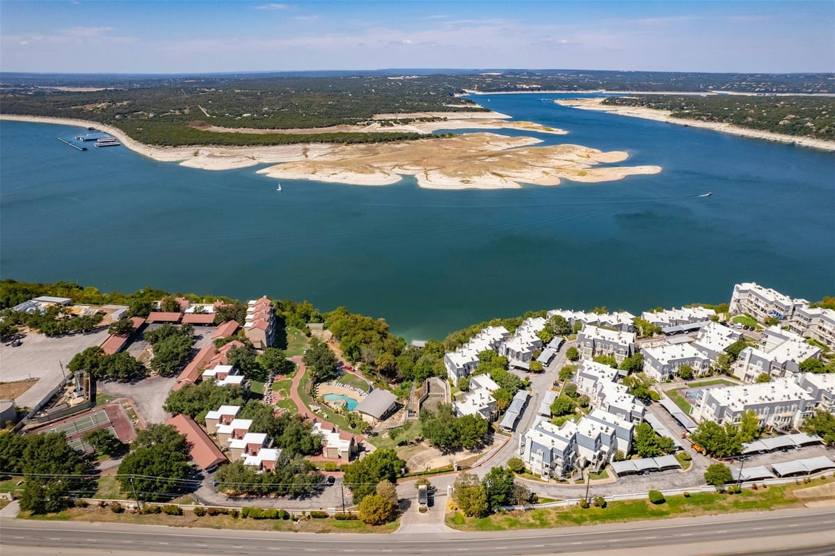 View 2918 N Ranch Road 620 Unit #W219 in Villas On Travis Condo Amd 2918 N Ranch Road 620 Unit #W219 - front exterior - Luxury home in Villas On Travis Condo Amd, Austin, TX
