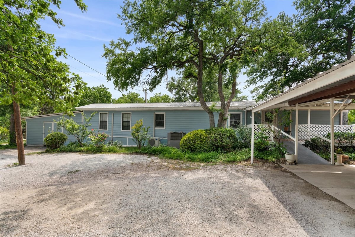 View 300 Corral Ln in San Gabriel River Ranch 300 Corral Ln - front exterior - Luxury home in San Gabriel River Ranch, Liberty Hill, TX