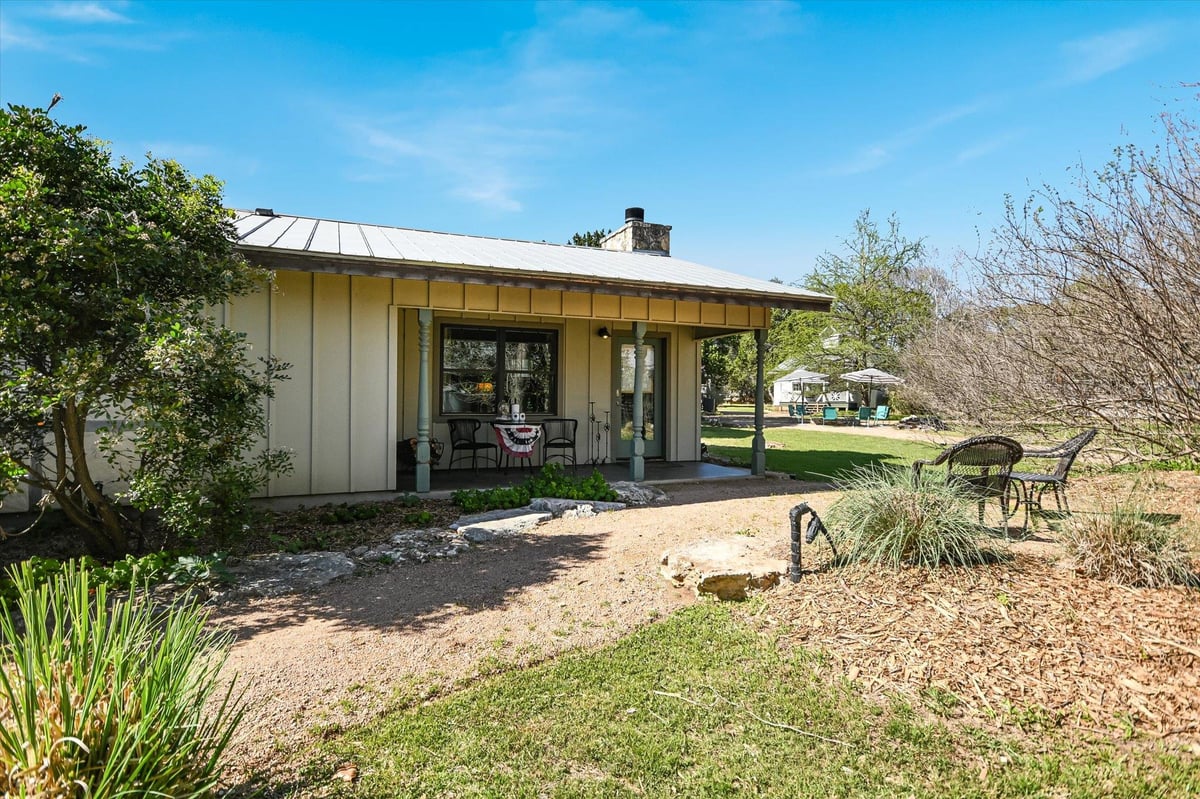 View 300 MILL RACE Ln Unit #4 in THE LODGE AT CREEKSIDE CONDOMINIUMS 300 MILL RACE Ln Unit #4 - front exterior - Luxury home in THE LODGE AT CREEKSIDE CONDOMINIUMS, Wimberley, TX